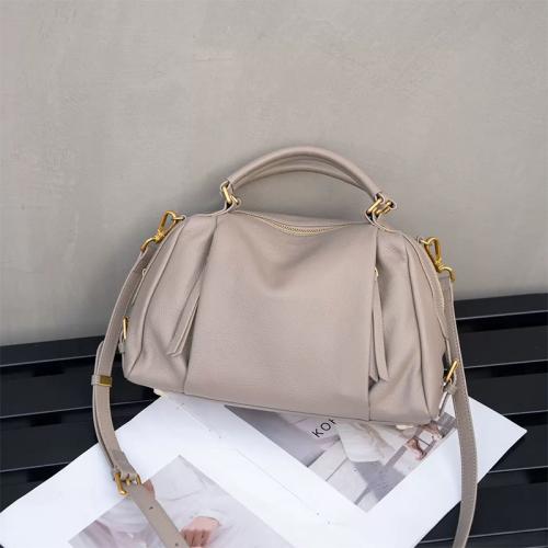 Cowhide Dumpling Handbag soft surface & attached with hanging strap Solid PC